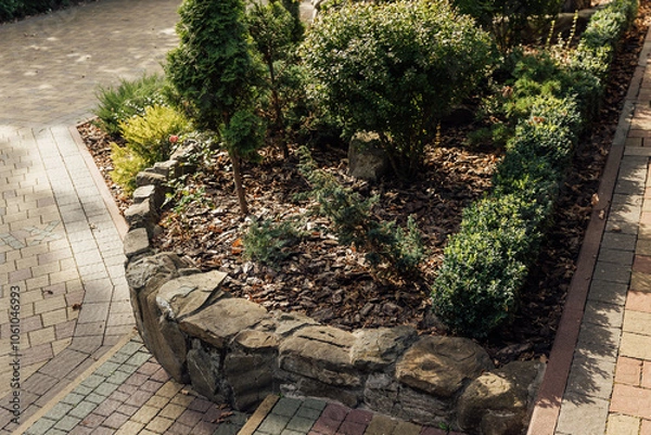 Fototapeta Beautiful summer garden with a walkway winding its way through