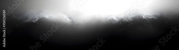 Fototapeta A dramatic sky with dark clouds illuminated by a bright light source, creating a moody and ethereal atmosphere that evokes a sense of mystery and awe.