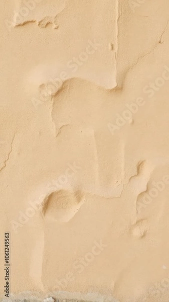 Fototapeta Abstract warm beige rock wall background with textured surface and earthy tones, wall
