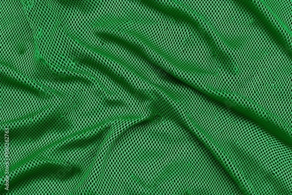 Fototapeta Close-up image of green mesh fabric with a wavy texture, showcasing an intricate pattern, perfect for background, textile, or design inspiration purposes.