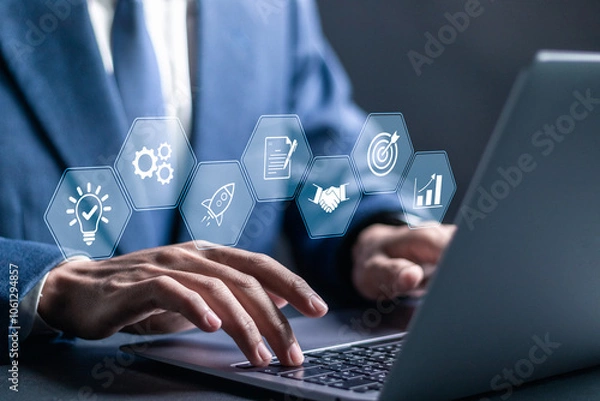 Fototapeta New business and startup concept, Strategic planning and business success. Businessman using laptop with startup icons for Ideas on starting a new business.