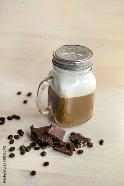 Fototapeta Coffee with drinking straw on wooden table