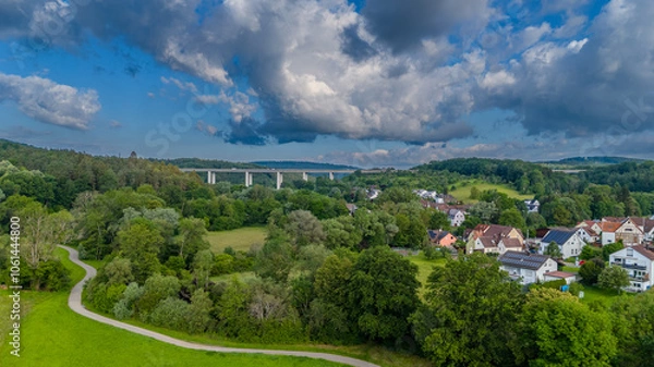 Obraz Bridge over valley with huge clouds