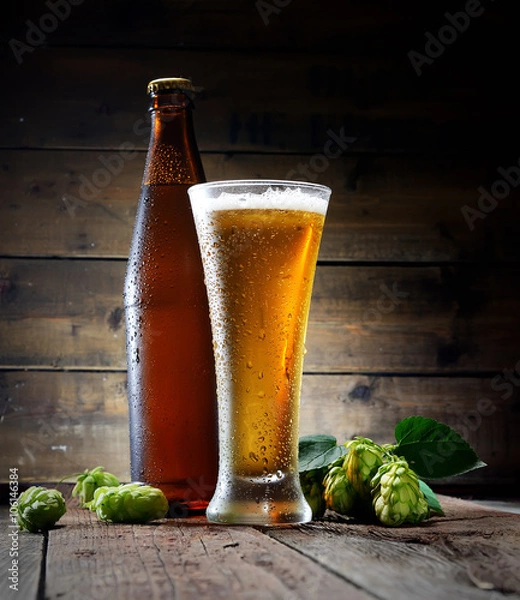 Fototapeta beer, bottle and hop on a wooden background

