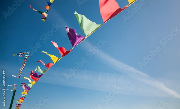 Obraz Flags against the blue sky