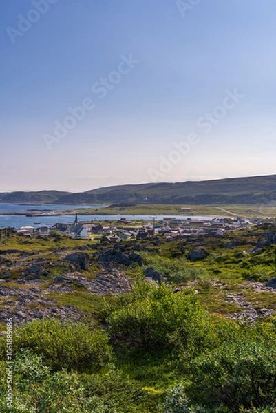 Fototapeta Scenic view of a rocky shore, mountains and fjords with Berlevag mountainscape in background at Finnmark, Norway