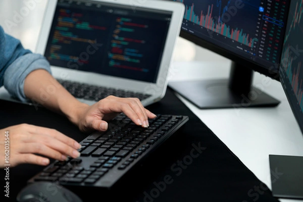 Fototapeta Cropped hands image of IT developer creating with typing information on pc with coding program information data website application, wearing jeans shirt surround safety analysis two screen. Stratagem.