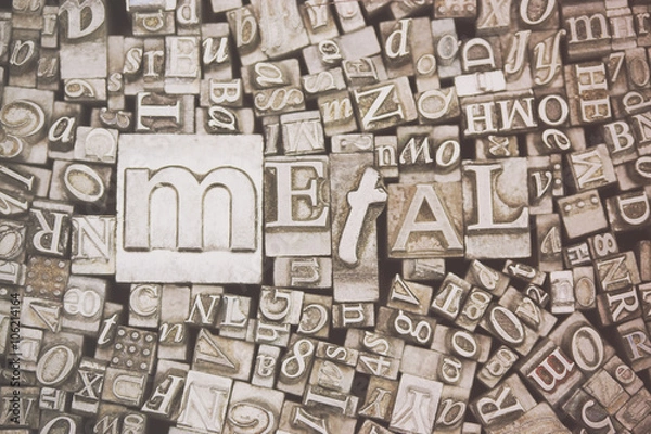 Fototapeta Close up of typeset letters with the word Metal
