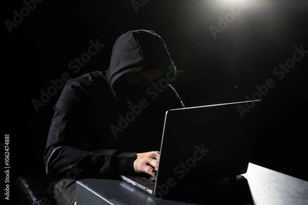 Fototapeta Hacker working on computer cyber crime