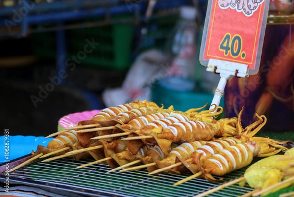 Fototapeta Cut the squid into bite-sized pieces, then skewer and grill.