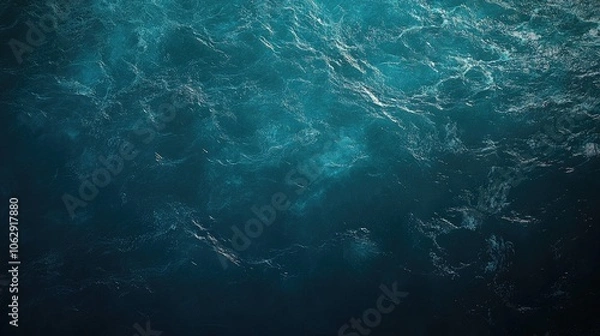 Fototapeta Aerial perspective of tranquil water waves in the sea highlights the vibrant turquoise hues, creating a serene ocean water background with ample copy space for design needs.