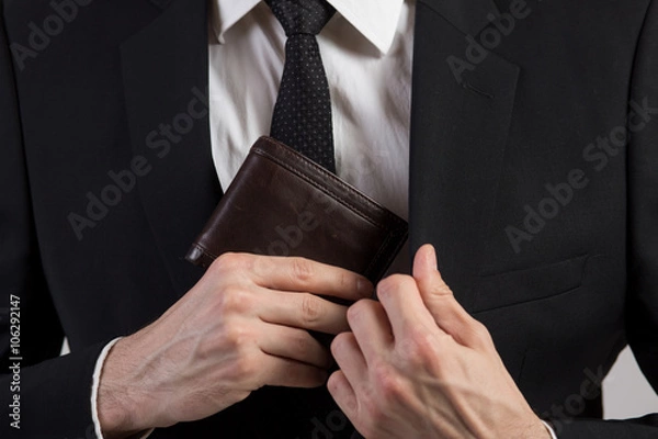 Fototapeta Businessman put his wallet back