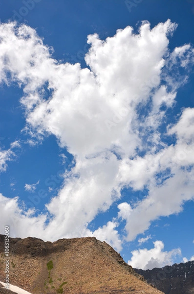 Fototapeta Idyllic summer landscape in the mountains with beautiful rocks and clouds. Terskey Alatoo mountains