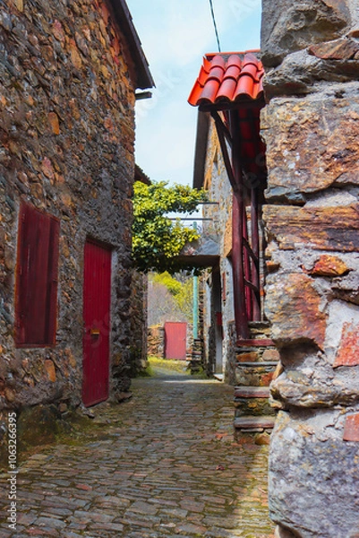 Fototapeta Rustic old stone houses in a peaceful and quiet village, capturing the calm and beauty of the spring season. Remote village setting. Responsible travel. Environmental protection.
