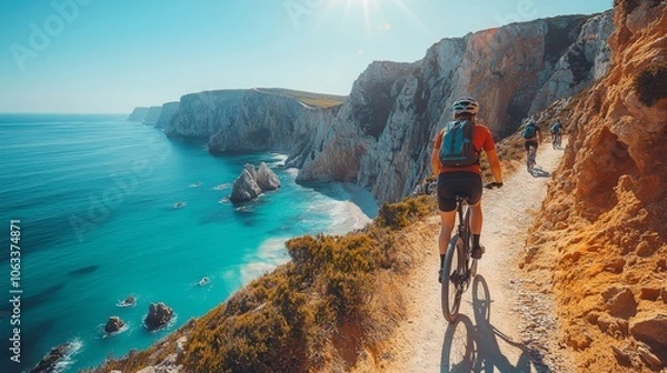Obraz Mountain Biking Adventure on a Cliffside Trail with Ocean Views