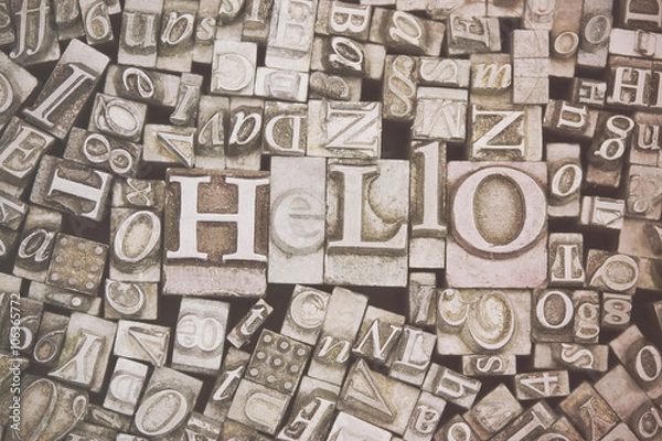 Fototapeta Close up of typeset letters with the word Hello