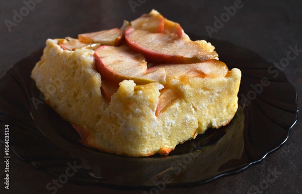 Fototapeta Apple Cottage Cheese Cake. Cottage cheese sweet casserole with apple layer on a plate. The blended cottage cheese gives it a smooth and velvety consistency.
