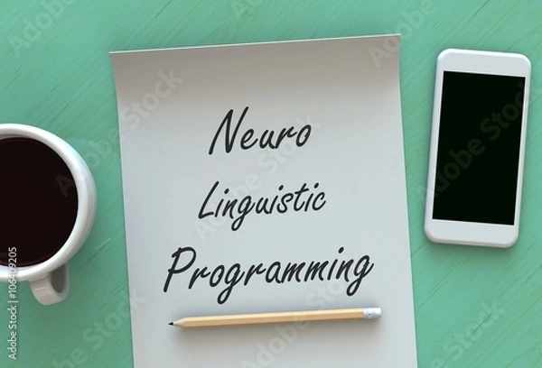Obraz Neuro Linguistic Programming, message on paper, smart phone and coffee on table