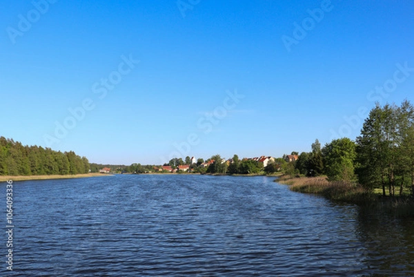 Fototapeta View from Lake Widmińskie towards the summer resort of Wydminy, Poland, Warmian-Masurian Voivodeship