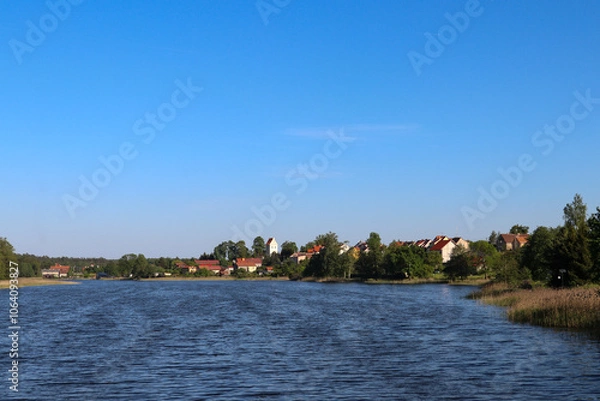 Fototapeta View from Lake Widmińskie towards the summer resort of Wydminy, Poland, Warmian-Masurian Voivodeship