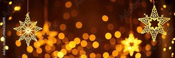 Fototapeta Golden star-shaped light shining brightly against a dark backdrop, holiday, background