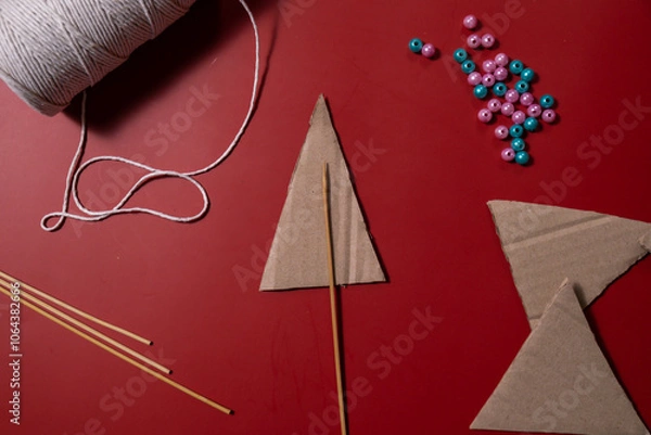 Fototapeta Christmas trees made of rope Sustainable Christmas preparation Diy process of making handmade decor. Step by step activity for children. Inclusive and responsible stress relief holiday hobby