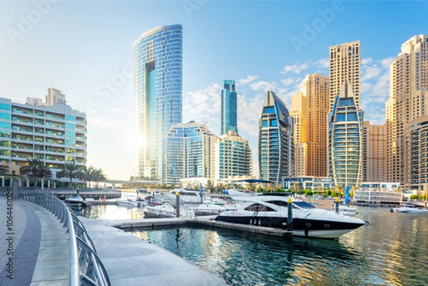 Fototapeta Beautiful view of Dubai Marina with modern buildings and yachts in the water.