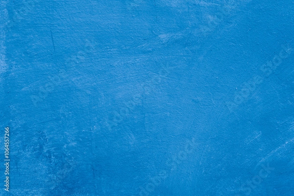 Obraz Grunge classic blue concrete background. Textured plaster wall. Creative backdrop for your design. Color of the year 2025 concept. Top view, layout for design. Surface with peeling shabby pattern.