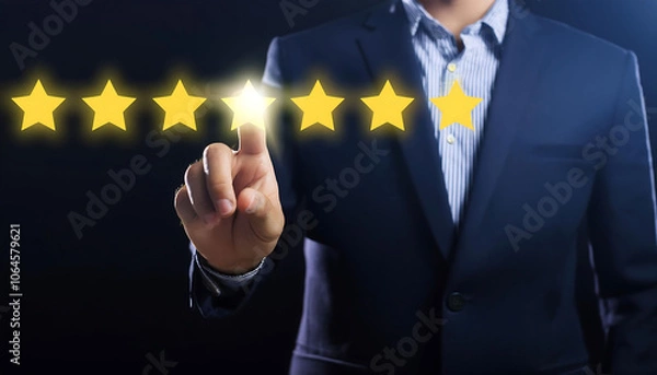 Fototapeta Hand Touching Five-Star Rating System with Glowing Stars