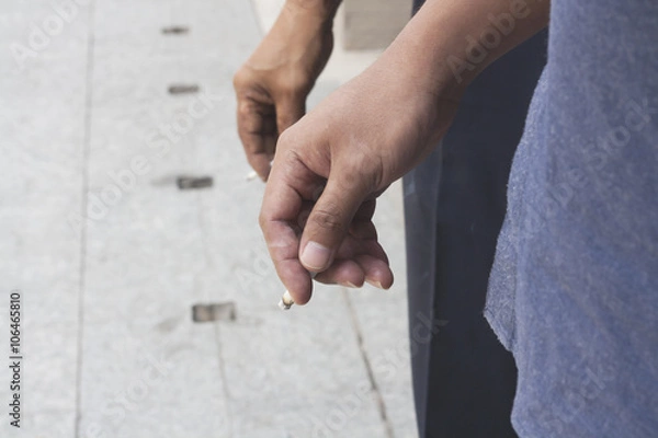 Fototapeta Hand Holding Cigarette While Smoking