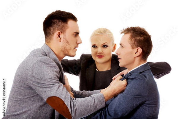 Fototapeta Businessmen getting into a fight woman trying to separate them