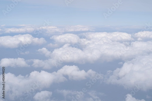 Fototapeta Beautiful, dramatic clouds and sky viewed from the plane