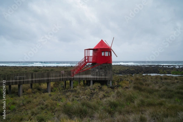 Fototapeta red windmill on pico of the azores