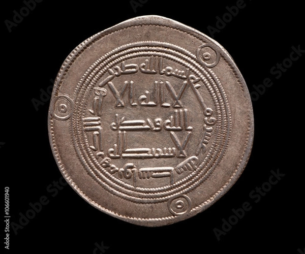 Fototapeta Arabic ancient silver coin isolated on black