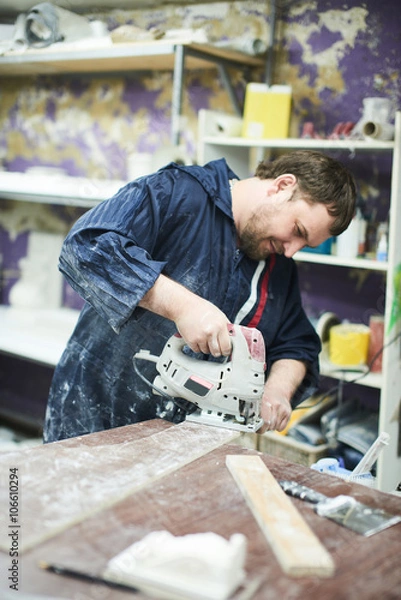 Fototapeta The master cuts the part