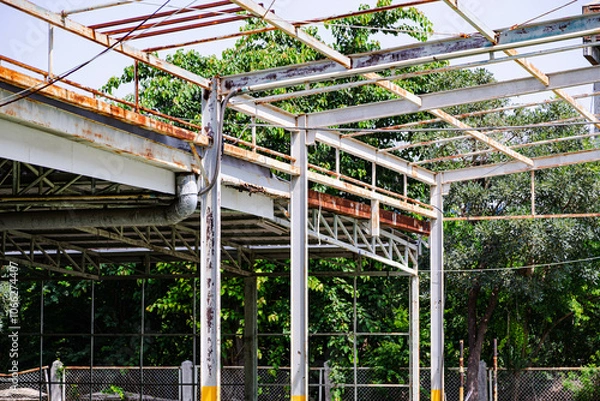 Fototapeta Steel structure in an old factory full of rust