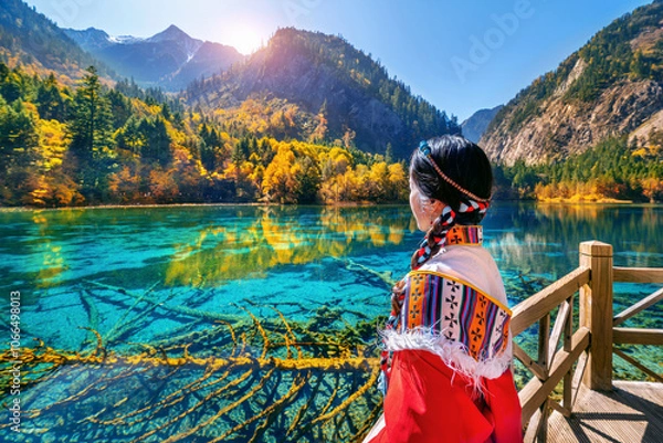 Obraz Tourist wearing traditional clothes at jiuzhaigou national park in autumn, Sichuan, China.