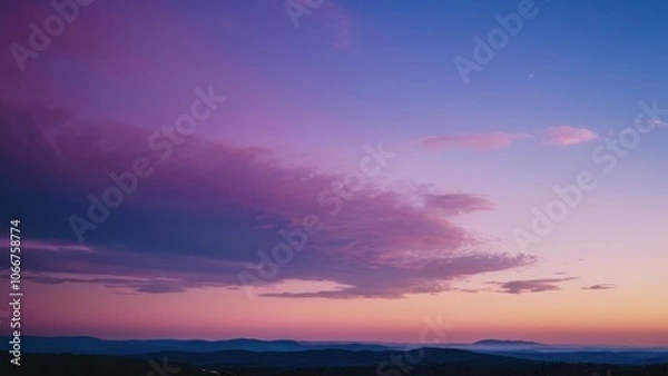 Fototapeta A breathtaking twilight scene showcasing a crescent moon and evening star over serene mountain silhouettes, perfect for nature lovers and tranquil landscapes