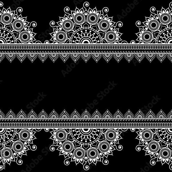 Fototapeta Border seamless pattern with Indian floral elements in mehndi style for card and tattoo isolated on black background.