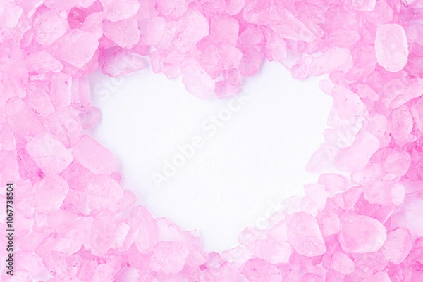 Fototapeta Pink bath salt with copy space is shape of a heart, macro