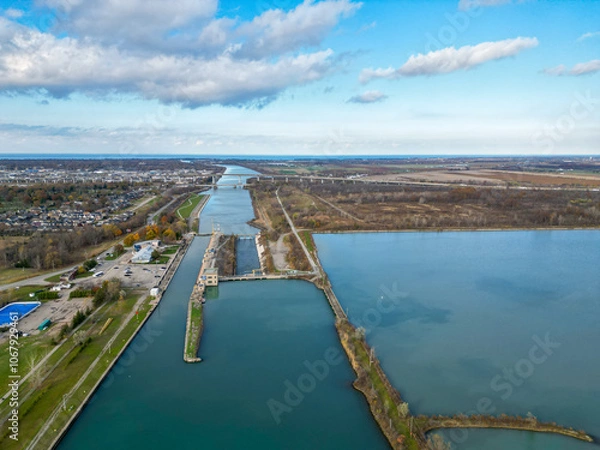 Obraz Aerial over the Welland Canal, part of the St. Lawrence Seaway and Great Lakes Waterway in St. Catharines, Ontario, Canada. Looking north towards lock 3 and Niagara-on-the-Lake and Lake Ontario. 