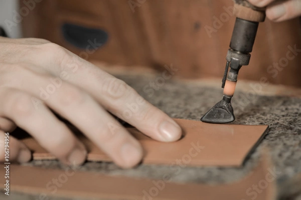 Fototapeta Trunk Maker at work in his luxury leather workshop