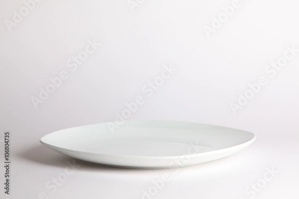 Obraz White empty plate on white background