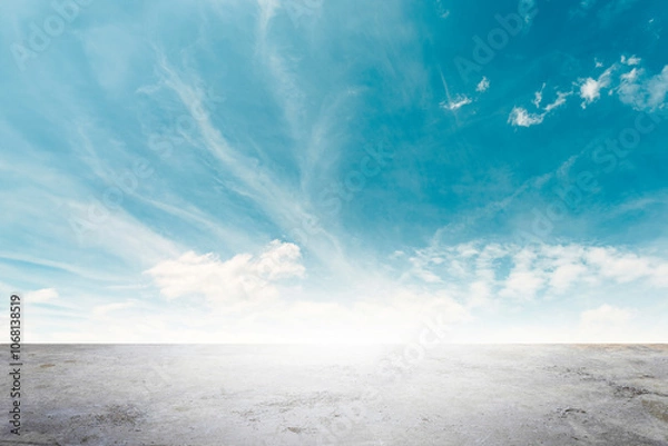 Fototapeta Wide empty grunge cement counter table top on blue sky clouds white light background for business product windy scene, blue sky empty land back a concrete road way