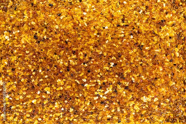 Obraz A scattering of small processed amber stones.