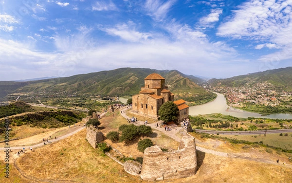 Fototapeta Aerial top view of ancient Jvari Monastery is a VI century Georgian Orthodox monastery. Holy Cross church is Early Medieval Georgian. Confluence of Kura and Aragvi. Tbilisi, Mtskheta, Georgia, Europe.