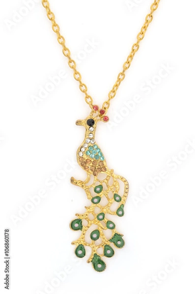 Fototapeta Pendant with gold bird isolated on white