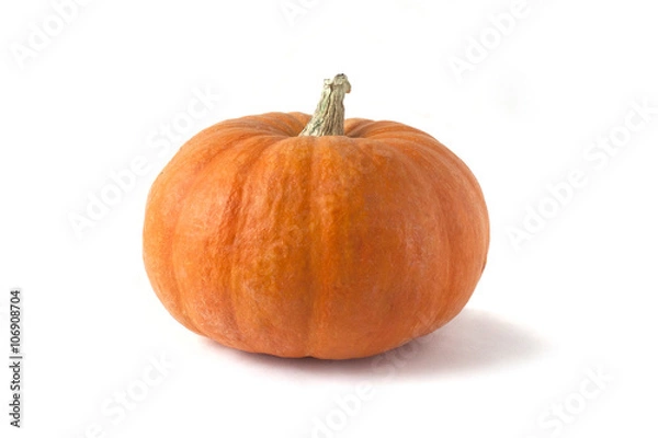 Fototapeta Bright orange pumpking on white background 
