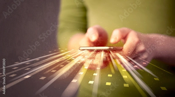 Fototapeta Person holding smarthphone with technology light applications