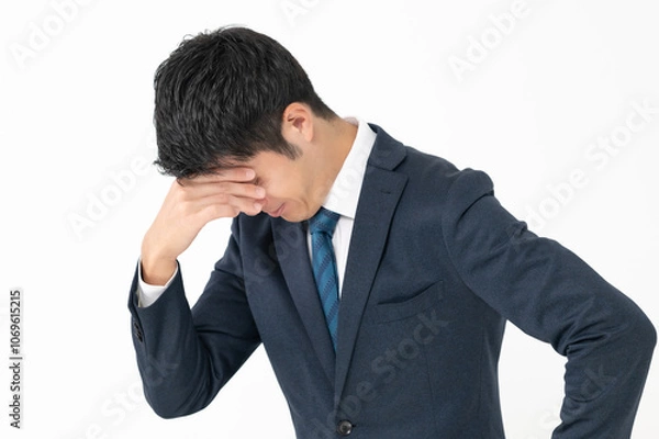 Fototapeta 頭を抱えるビジネスマン